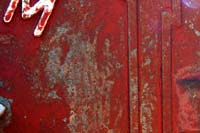 Cracking peeling paint on a fire call box
